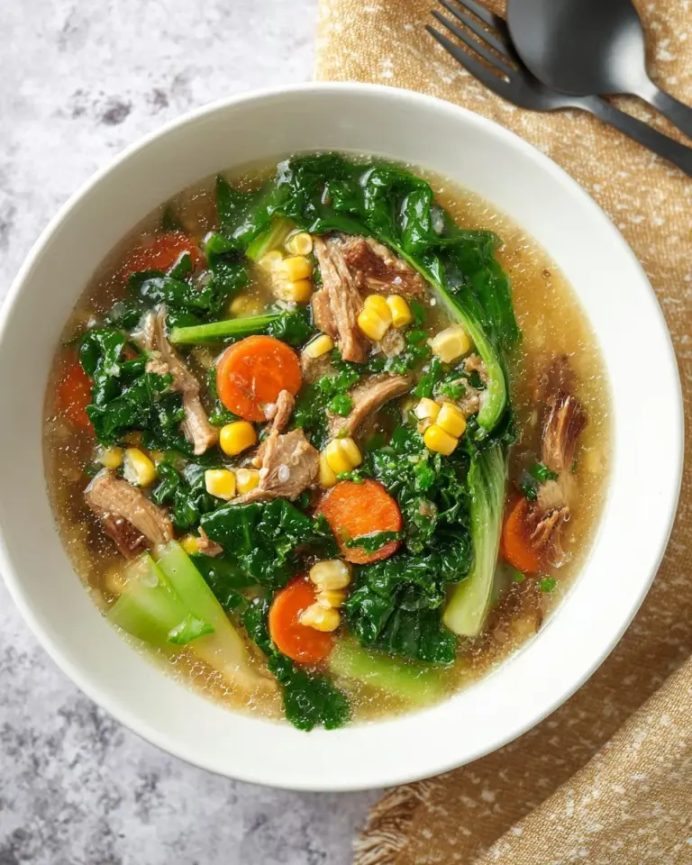 A traditional Rad Na dish served with wide rice noodles, vegetables, and savory sauce.
