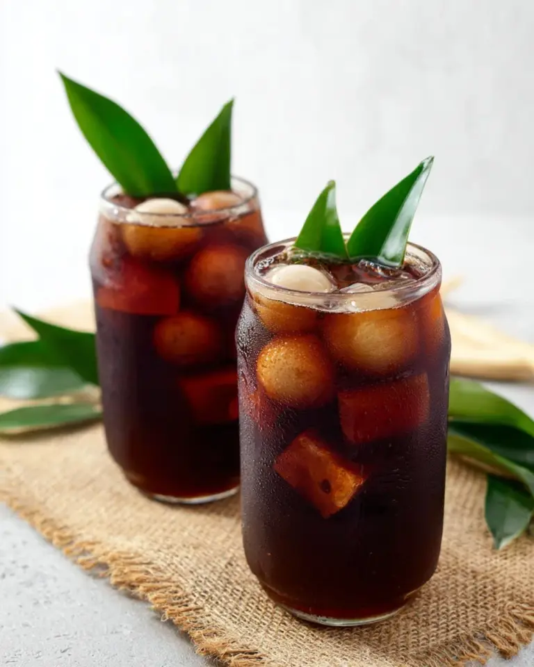 Glass of refreshing Thai Longan Drink with longan fruit and ice